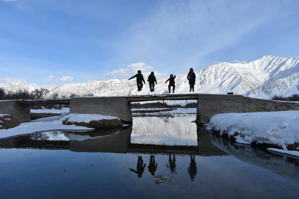 Visitors in the snow-covered Ladakh landscape